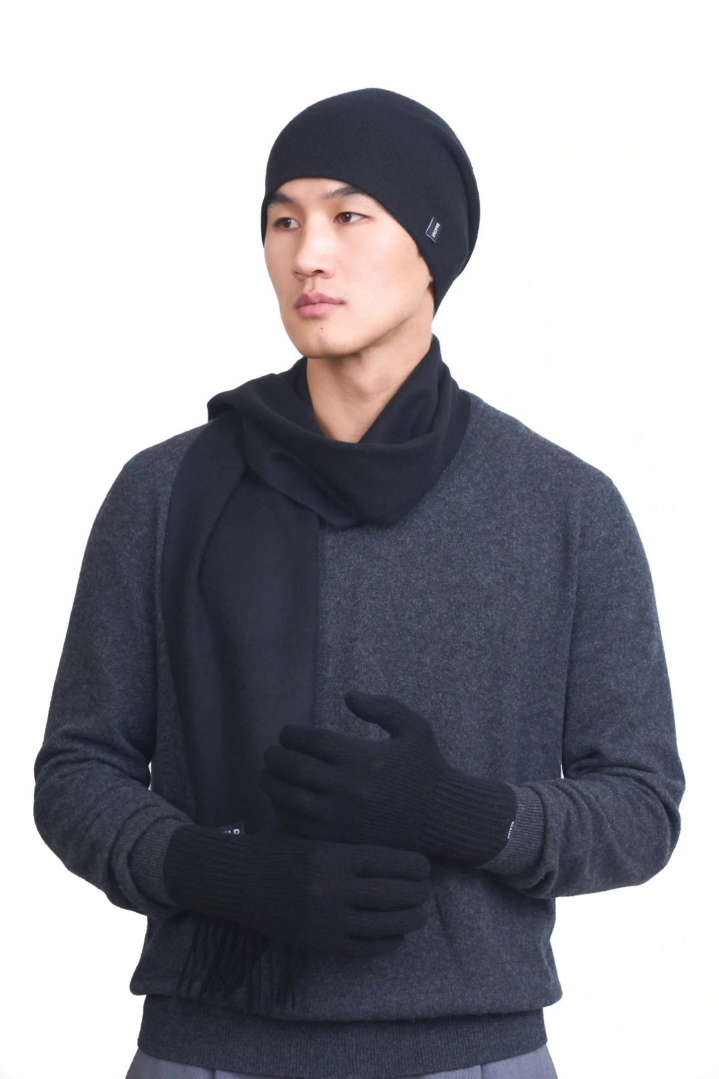 Luxurious black Mongolian cashmere set of gloves, beanie and scarf with soft, lightweight texture, perfect for winter warmth and elegant styling