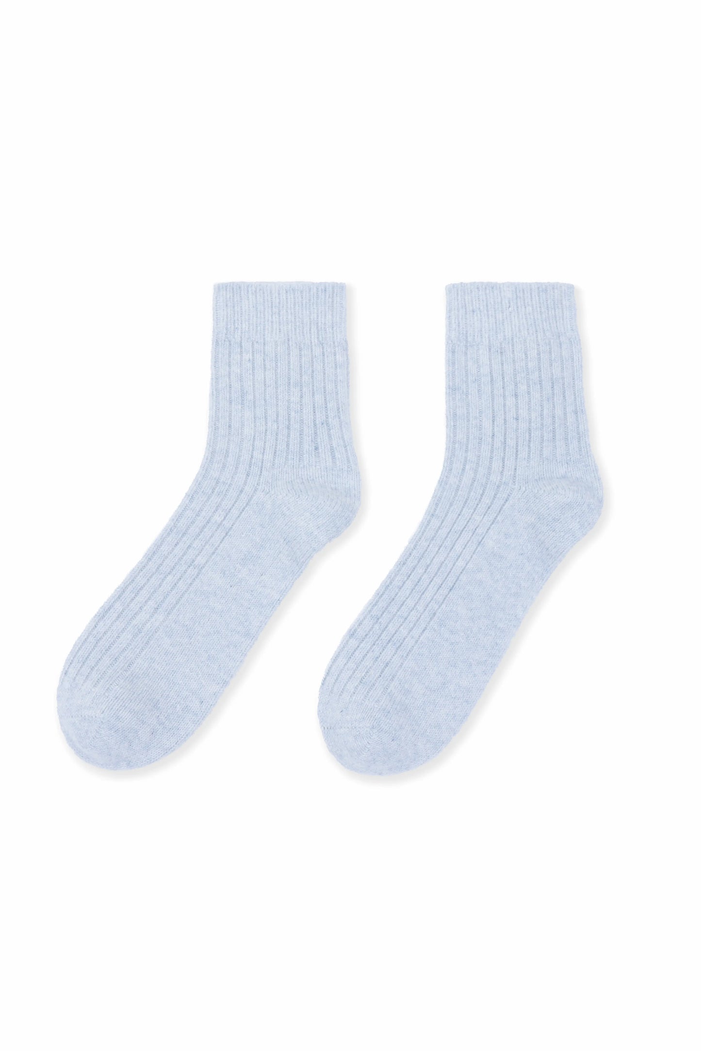 Cozy and soft gray Mongolian cashmere socks laid flat on a white background, showcasing their luxurious texture and warmth