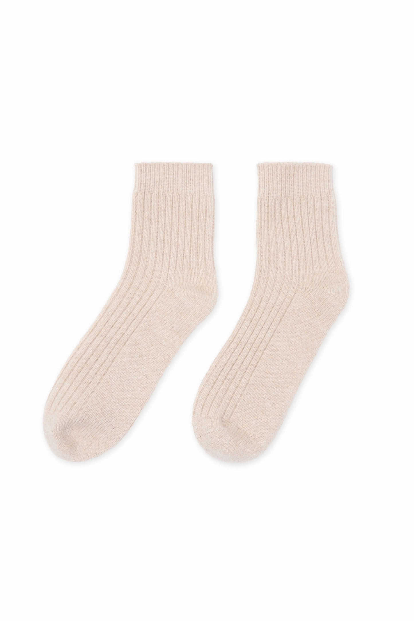 Cozy and soft beige Mongolian cashmere socks laid flat on a white background, showcasing their luxurious texture and warmth