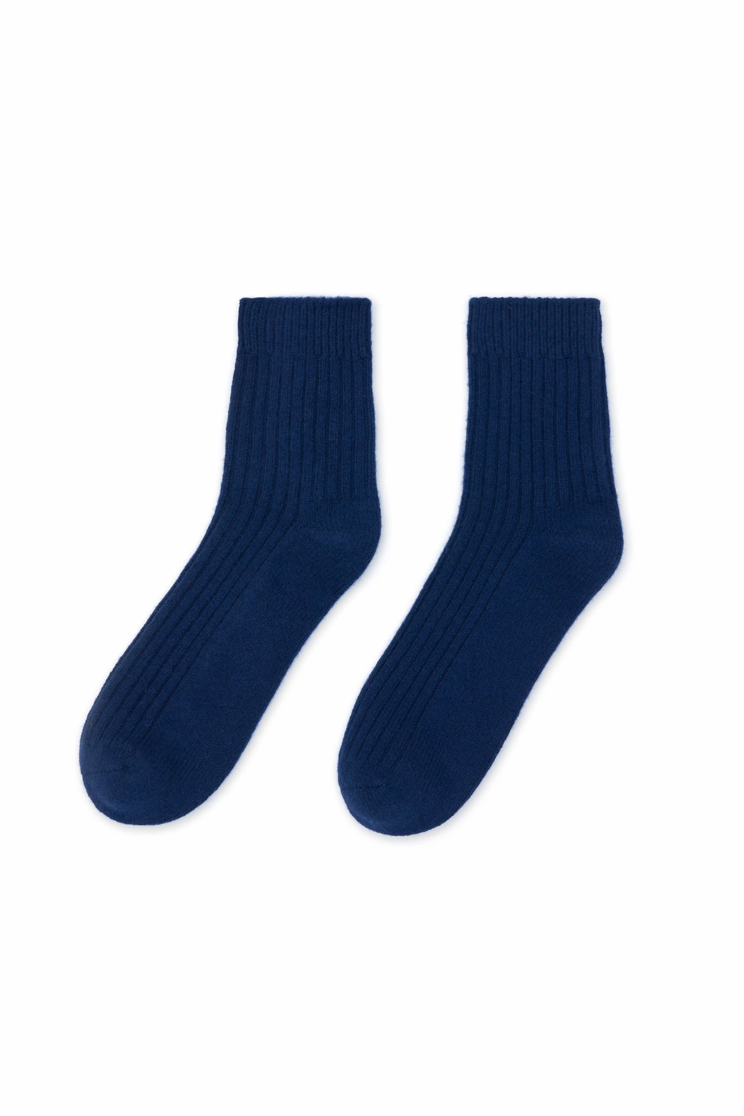 Cozy and soft navy blue Mongolian cashmere socks laid flat on a white background, showcasing their luxurious texture and warmth