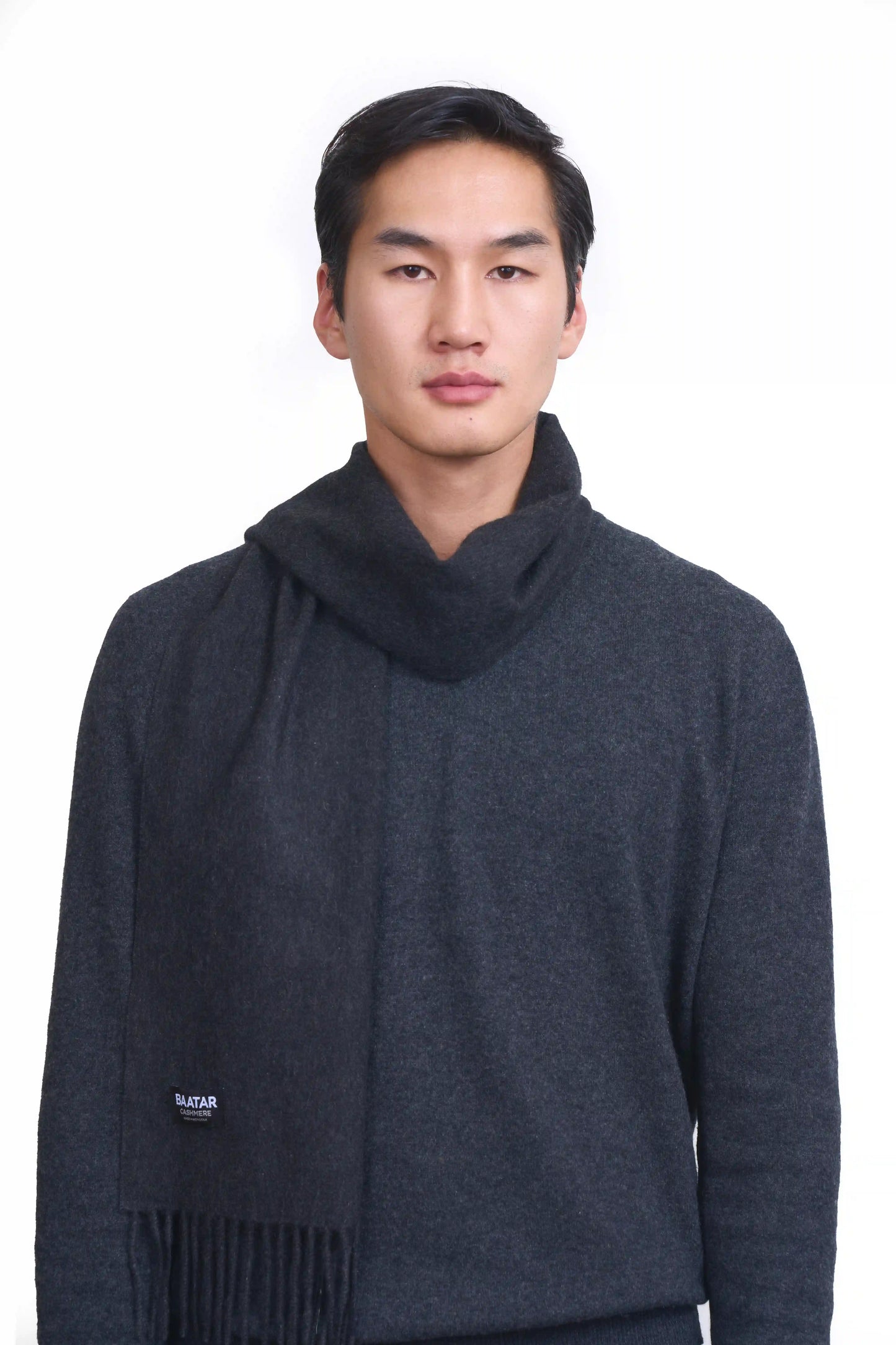 Luxurious charcoal Mongolian cashmere scarf worn on a male Mongolian model, lightweight and cozy, perfect for winter layering