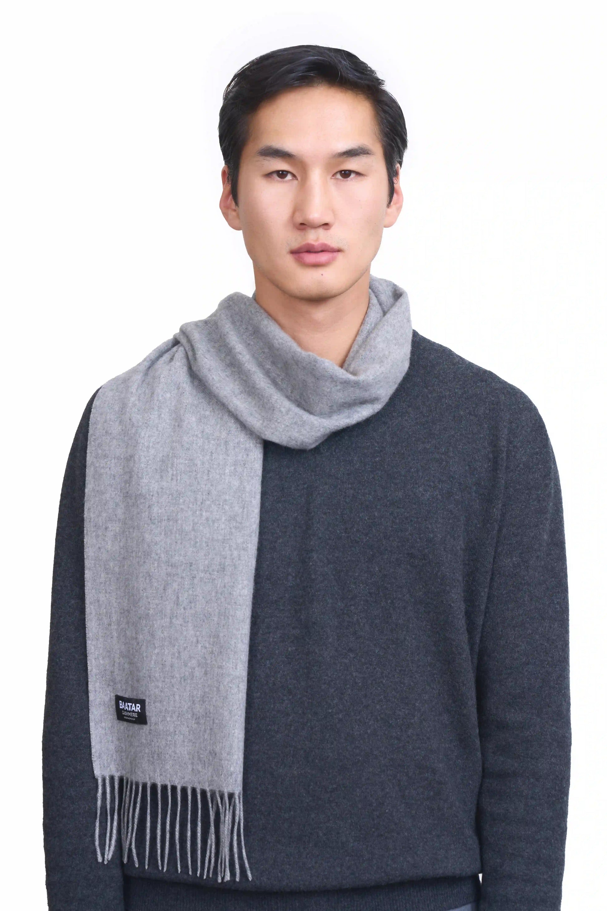 Luxurious light gray Mongolian cashmere scarf worn on a male Mongolian model, lightweight and cozy, perfect for winter layering