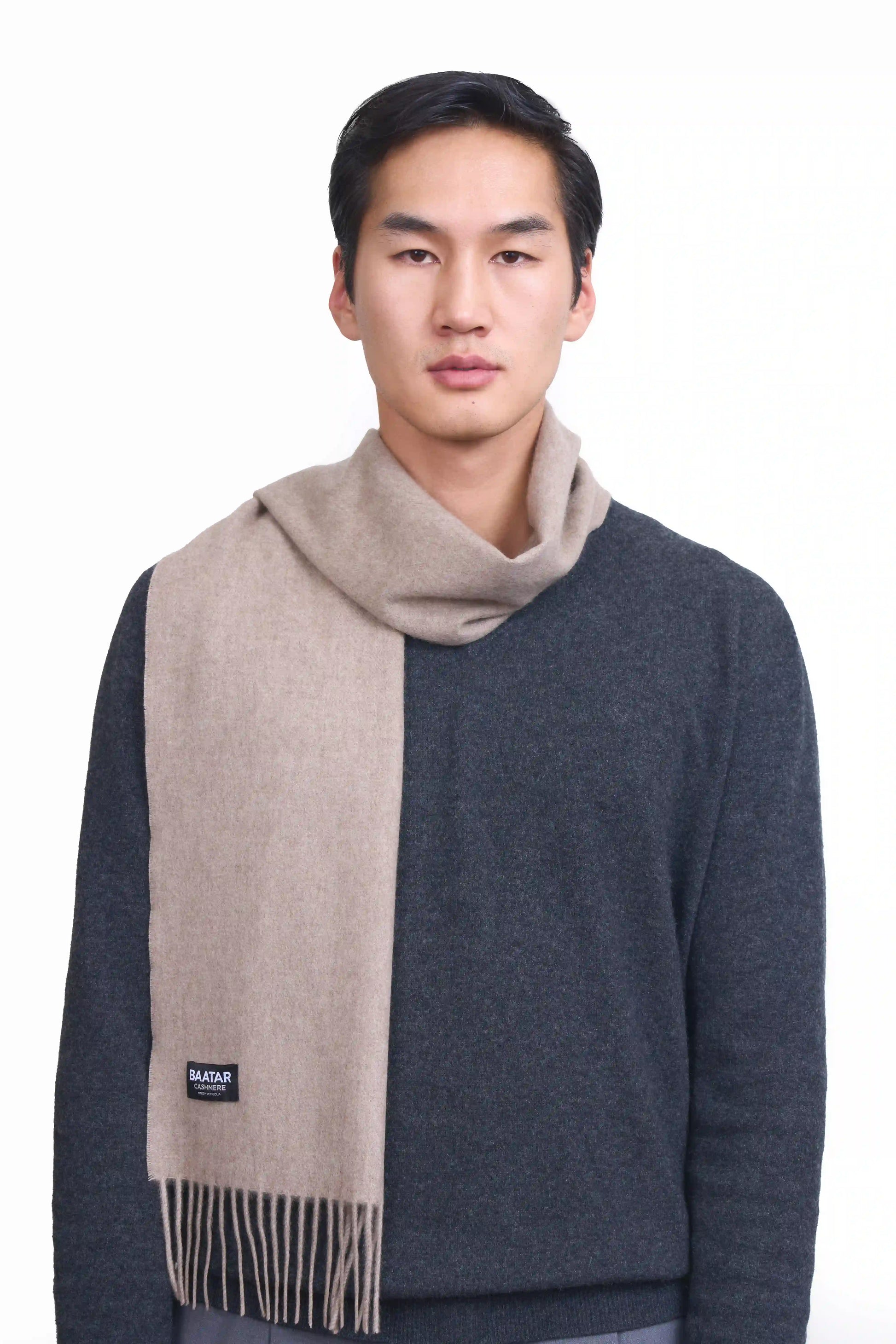Luxurious natural beige Mongolian cashmere scarf worn on a male Mongolian model, lightweight and cozy, perfect for winter layering