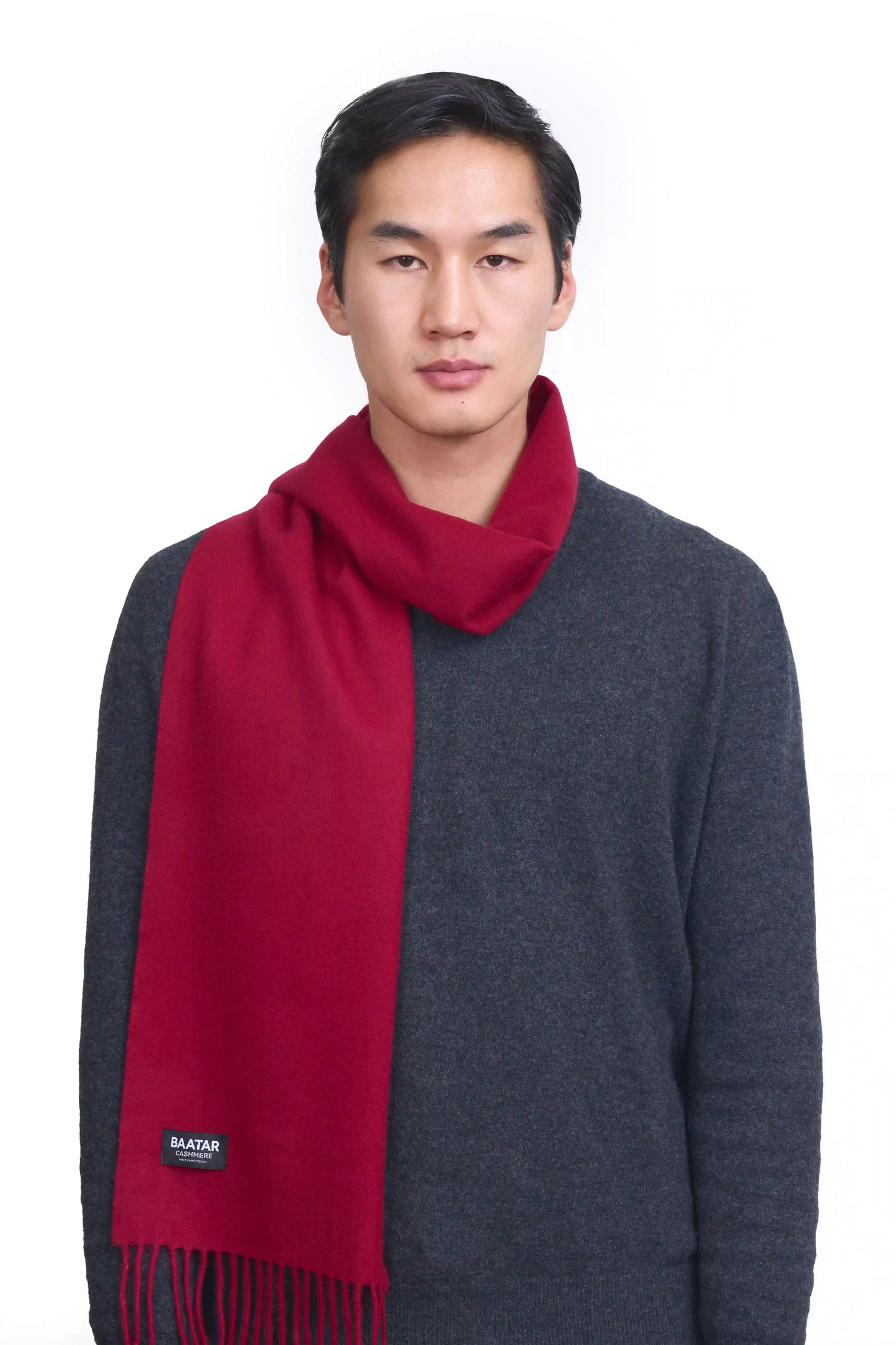 Luxurious burgundy red Mongolian cashmere scarf worn on a male Mongolian model, lightweight and cozy, perfect for winter layering