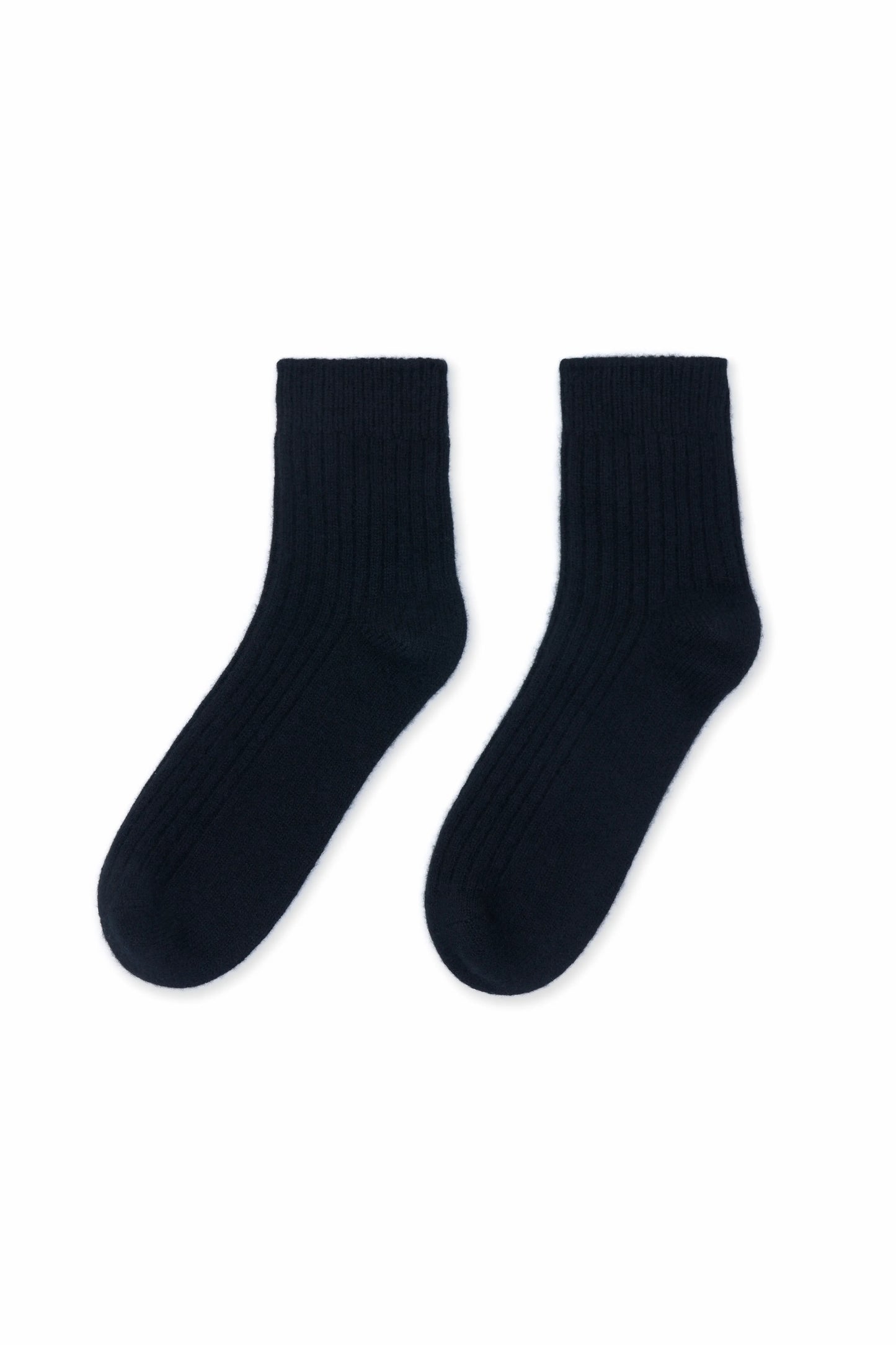Cozy and soft black Mongolian cashmere socks laid flat on a white background, showcasing their luxurious texture and warmth