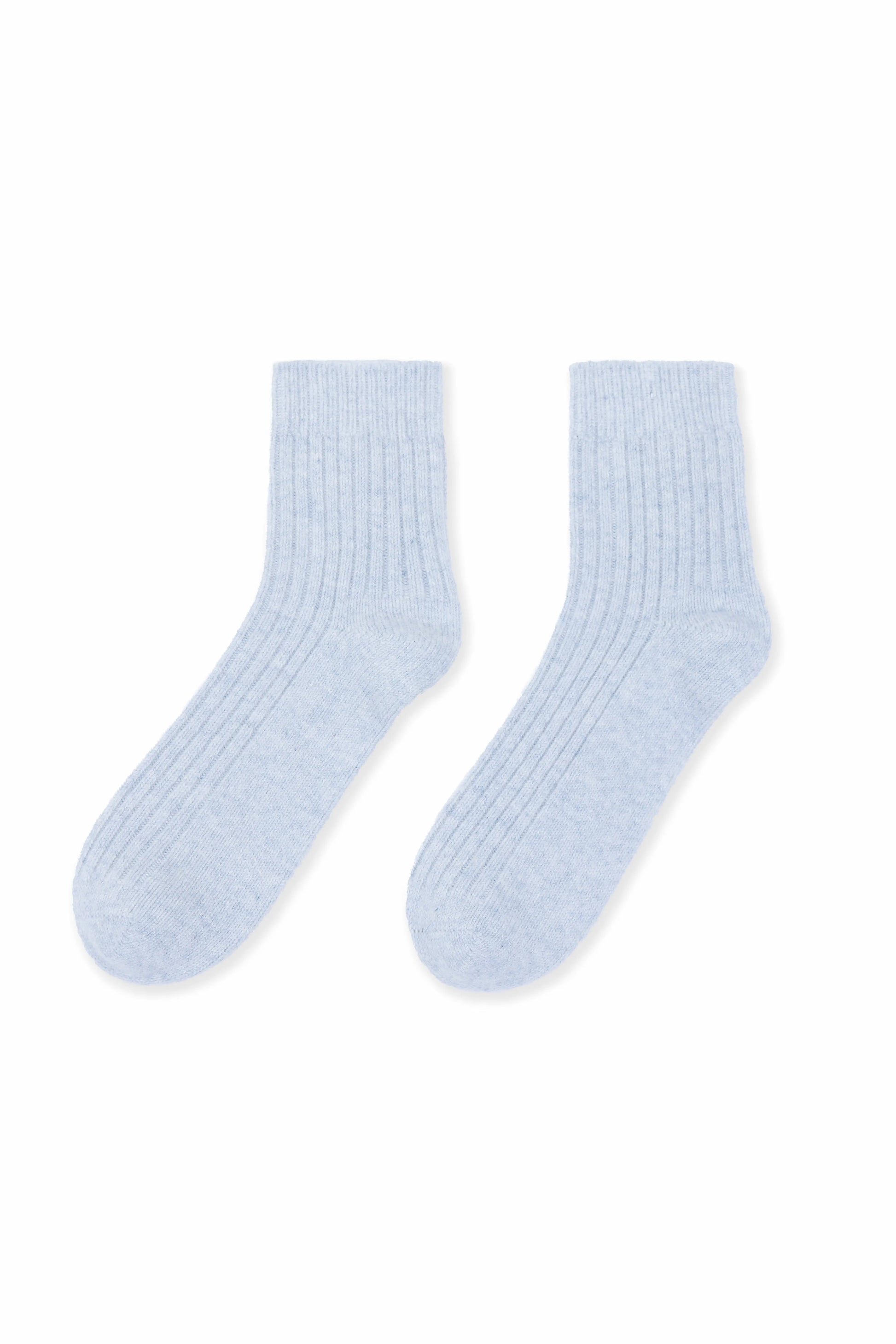 Cozy and soft gray Mongolian cashmere socks laid flat on a white background, showcasing their luxurious texture and warmth