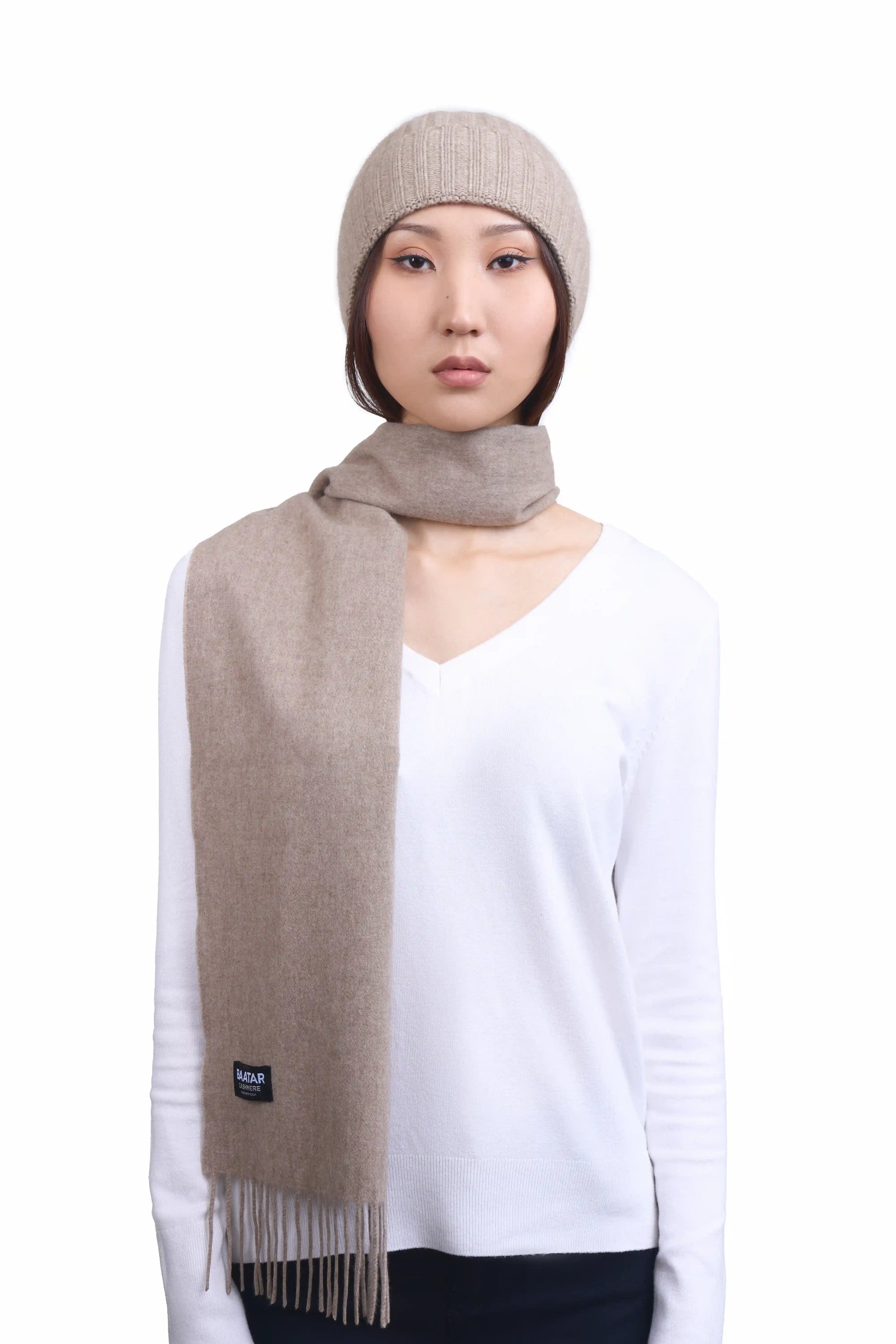 Luxurious natural beige Mongolian cashmere scarf worn on a female Mongolian model, lightweight and cozy, perfect for winter layering