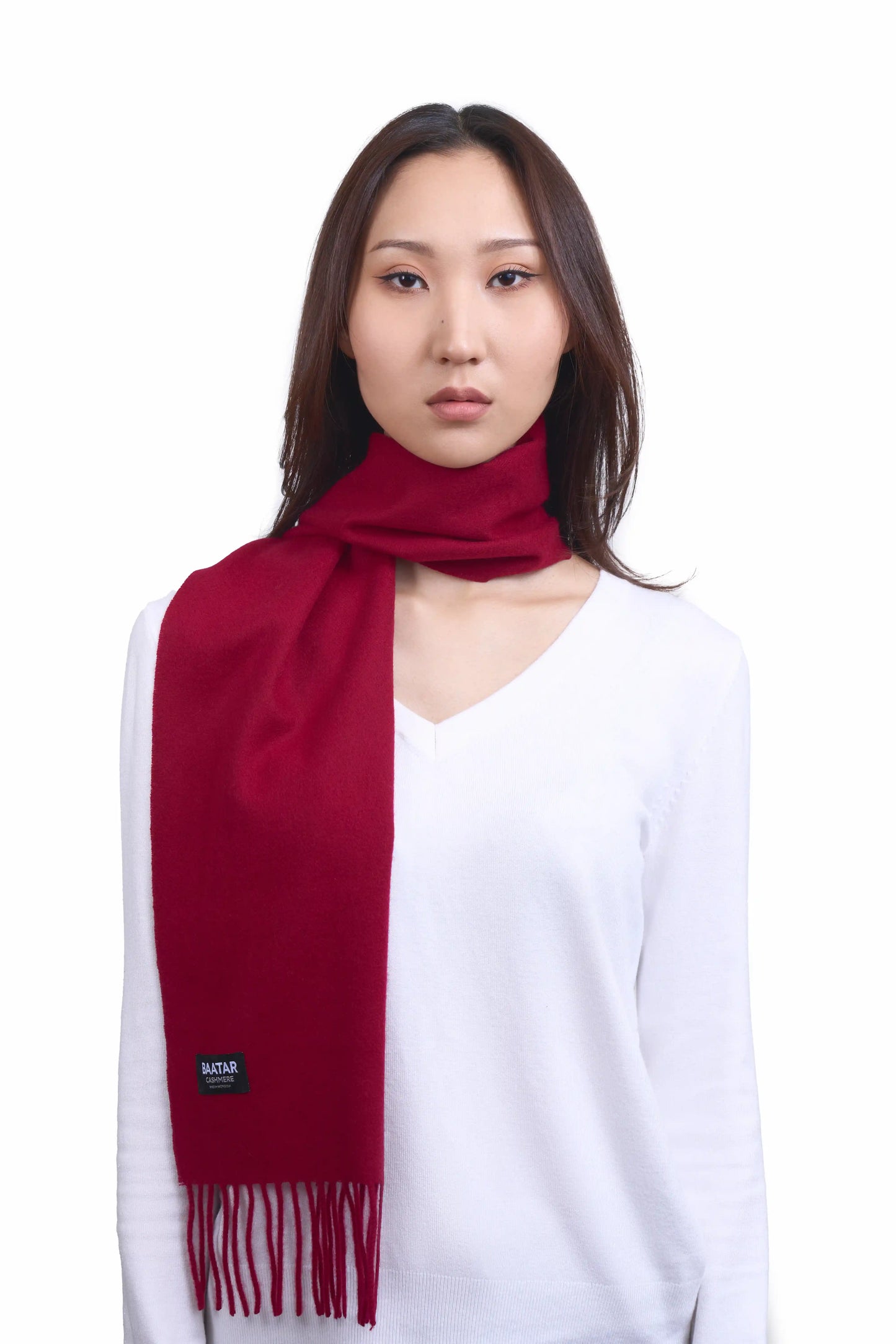 Luxurious burgundy red Mongolian cashmere scarf worn on a female Mongolian model, lightweight and cozy, perfect for winter layering